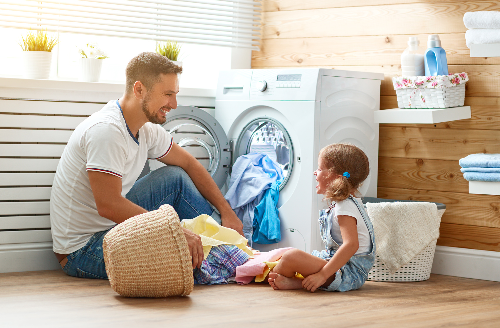 father and daughter in custom designed laundry room