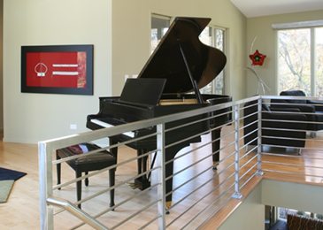 Michael and associates custom home piano room on second floor of spacious home