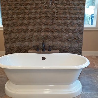 Michael and associates bathroom with open wall and tiled backsplash
