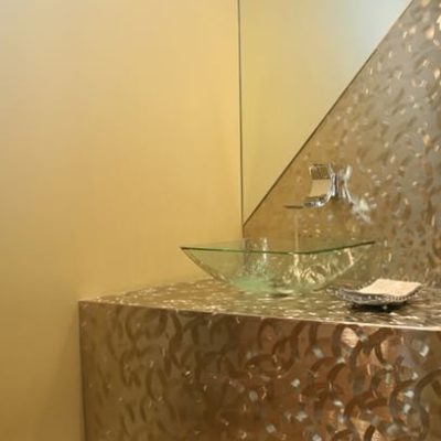 Glass sink feature with mirror and vanity