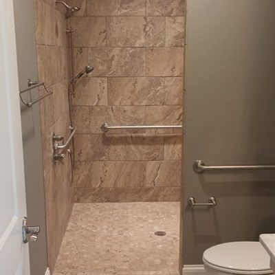 Marble and tile custom home bathroom with shower
