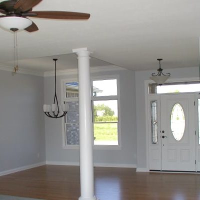 New custom home with large window and hardwood floors