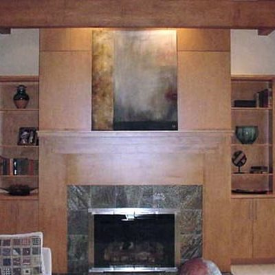 Michael and associates custom living room with built-in entertainment center around custom fireplace