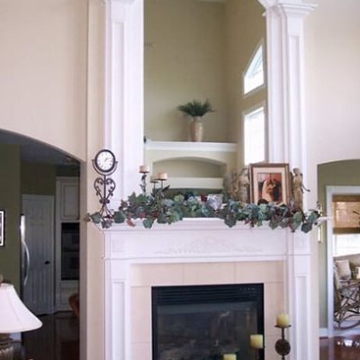 Custom fire mantle with large arching mirror