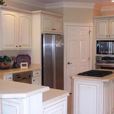 Michael and associates custom kitchen featuring white cabinets and white countertops