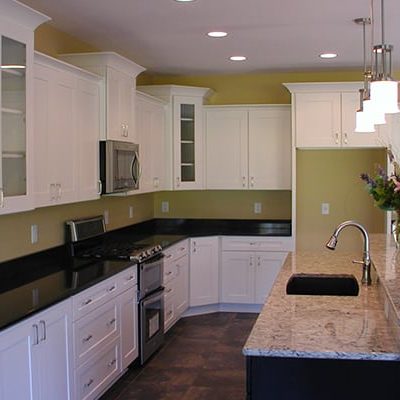 Michael and associates custom kitchen with black countertops and white cabinets
