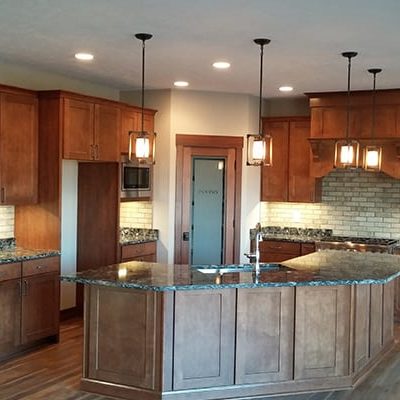 Michael and associates custom home kitchen with hardwood floors and marble countertops